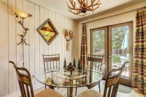 a dining room with a glass table and chairs at Bear Claw Trails in Lake Tahoe Airport