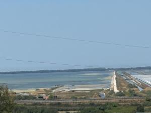 an aerial view of a highway next to a body of water at ANN World in Vlorë