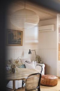 a living room with a table and a couch at 101 Oatlands Tasmania in Oatlands