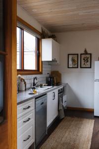 a kitchen with a sink and a stove at 101 Oatlands Tasmania in Oatlands +30 photos