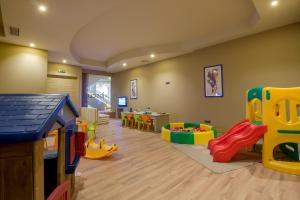 a childs play room with toys and a table at Calheta Beach - All-inclusive - Savoy Signature in Calheta