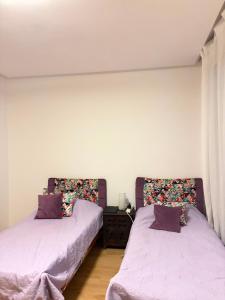two beds sitting next to each other in a room at Best Sea View in Morocco in Sidi Bouqnadel +44 photos
