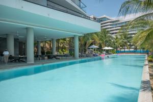 an infinity pool at the resort at Condo in Bucerías Beachfront Narval Norte in Bucerías