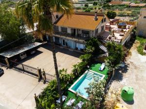 an aerial view of a house with a swimming pool at Villa en Lorca 2 Piscinas Vistas Gran Terraza y Barbacoa-Venta Ruizo Hasta 20 personas in Lorca