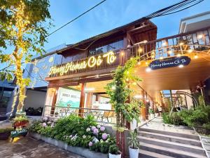 a building with a sign on the front of it at Honey Homes Cô Tô in Đảo Cô Tô