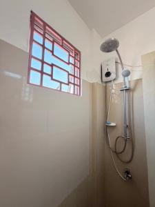 a shower in a bathroom with a window at Casa Saturnino Private Staycation  +18 photos