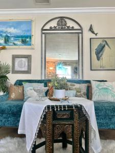 a living room with a table and a couch at Luxury Waterfront Villa, With Private Hot Tub, Beachs, Aventura Mall Casinos, Restaruants in Hallandale Beach +33 photos