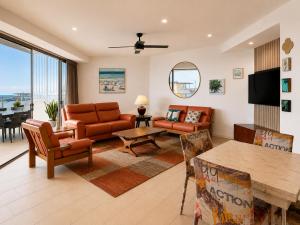 a living room with a couch and a table at Space Holiday Apartments in Maroochydore