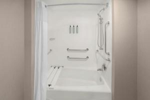 a bathroom with a bath tub and a shower at Residence Inn Mystic Groton in Mystic +26 photos