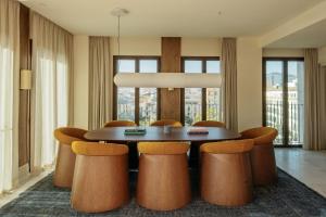 a dining room with a table and chairs at ME by Meliá Malaga in Málaga +53 photos