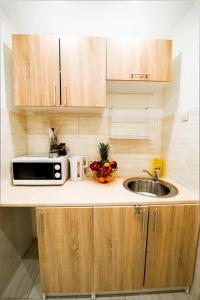 Kuchyňa alebo kuchynka v ubytovaní Królewski Apartament