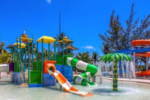 a water park with a bunch of slides and water slidesktop at Meliá Casa Maya Cancún in Cancún