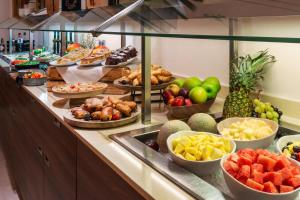 a buffet with many different types of fruits and vegetables at Meliá Düsseldorf in Düsseldorf