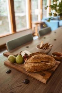 a loaf of bread and pears on a wooden table at Warburton Stays Grand View in Warburton