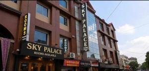 a large building with signs on the side of it at Hotel O Sky Rooms in Jammu