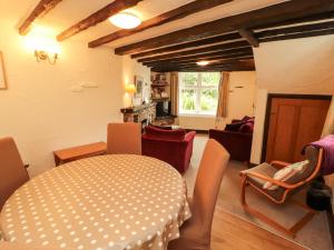 a living room with a table and chairs at The Orchard in Kendal