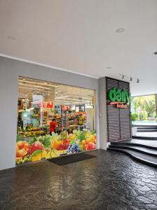 a grocery store with a display of fruits and vegetables at Grand Tropic Suites Hotel in Jakarta