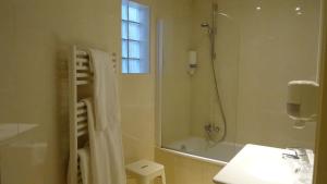 a bathroom with a shower and a sink and a toilet at Residence Club Inn in Nice