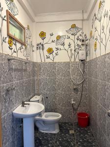 a bathroom with a toilet and a sink at Villa Consolacion Resort in General Luna +41 photos
