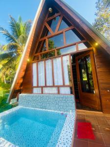 a house with a swimming pool in front of it at Gimanhala Thisawewa in Anuradhapura