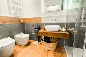 a bathroom with a sink and a toilet at Palazzo del Poeta - Dimora Contemporanea in Palermo