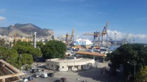 a view of a harbor with a cruise ship at Vista sul porto in Palermo