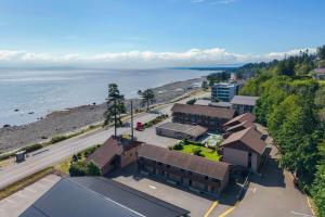 an aerial view of a building next to the ocean at Ramada by Wyndham Campbell River in Campbell River