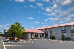 a hotel with a parking lot in front of it at Americinn by Wyndham Appleton Downtown in Appleton