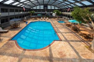 an overhead view of a large swimming pool in a building at Americinn by Wyndham Appleton Downtown in Appleton