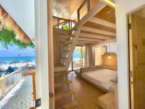 a bedroom with a bed and a view of the ocean at Tonsak Resort in Ko Samed +285 photos