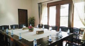 a long table with chairs and water bottles on it at Doltara Boutique Resort in Chiang Mai +134 photos