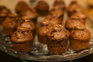 a bunch of chocolate muffins on a silver tray at La Maison des Armateurs in Saint Malo +87 photos