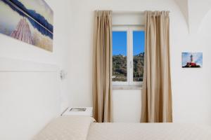 Кровать или кровати в номере Villa Pollio Guest House