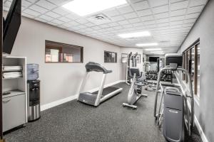 a gym with treadmills and elliptical machines at Wingate by Wyndham Sylvania-Toledo in Sylvania