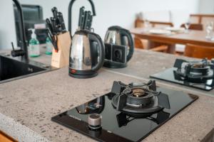 a camera sitting on top of a kitchen counter at Snuggy Shack Villas in Munggu