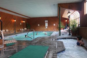 a group of people in a swimming pool at Nordic Inn Condominium Resort in Lincoln