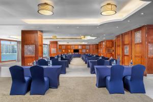 a banquet hall with blue tables and chairs at Hilton Alexandria Corniche Hotel in Alexandria +213 photos
