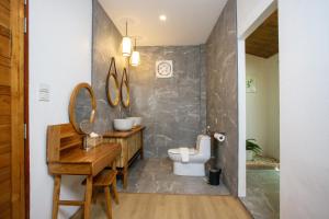 a bathroom with a sink mirror and a toilet at Villa Vara - Tropical Pool Villa in Ao Nang Beach +121 photos