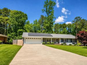 a white house with a garage at Tucked away in Tucker in Tucker +17 photos