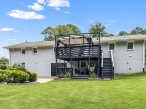 a house with a spiral staircase in a yard at Tucked away in Tucker in Tucker