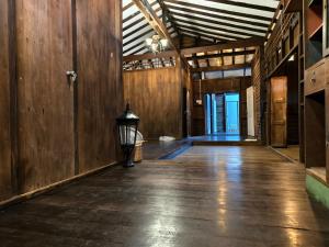 an empty hallway with a lamp in the middle of a building at Thanomrak homestay in Ban Pha Saeng Lang