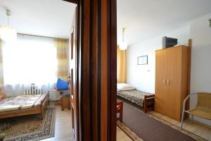 Posteľ alebo postele v izbe v ubytovaní Panterej Pokoje Gościnne