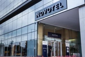 a man standing in the doorway of a noocom store at Novotel RJ Porto Atlantico in Rio de Janeiro