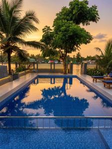 a swimming pool on top of a building at Captains Cabin, Alleppey- A Premium Backwater Mansion in Alleppey