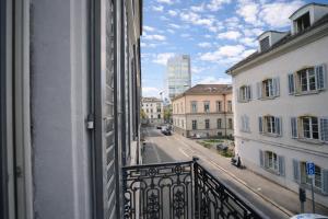 a view of a street from a balcony of a building at VISIONAPARTMENTS Gerechtigkeitsgasse - self check-in in Zurich