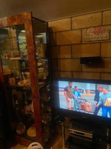 a television screen with people playing a video game at Lavanda City in Sevan +4 photos