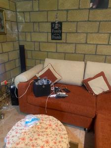 a living room with two couches and a brick wall at Lavanda City in Sevan