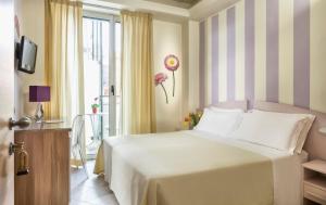 Posteľ alebo postele v izbe v ubytovaní ACasaMia WelcHome Hotel