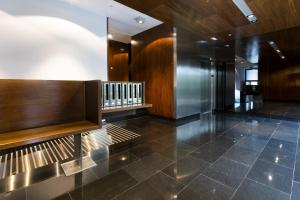a lobby with a tile floor and a staircase at Loft by Basquelidays in Hondarribia