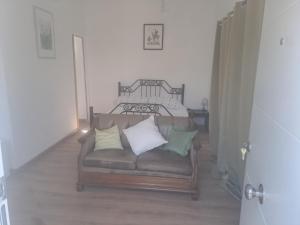 a couch with pillows sitting in a living room at CocoHills in Monte Pego +15 photos